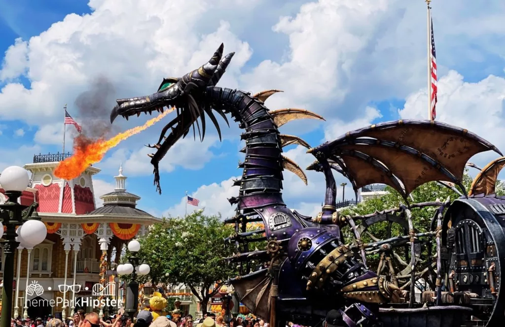 Disney Magic Kingdom Theme Park Festival of Fantasy Parade Sleepy Beauty and Maleficent Fire Breathing Dragon. Keep reading to learn How to Find the BEST Disney Travel Agent and Why You NEED One!