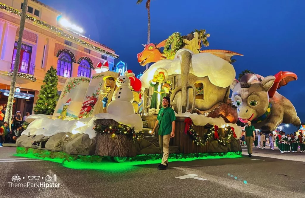 Christmas at Universal Orlando Holiday Parade featuring Macy's Shrek and Fiona. Keep reading to find out more about Universal Studios Christmas Parade.