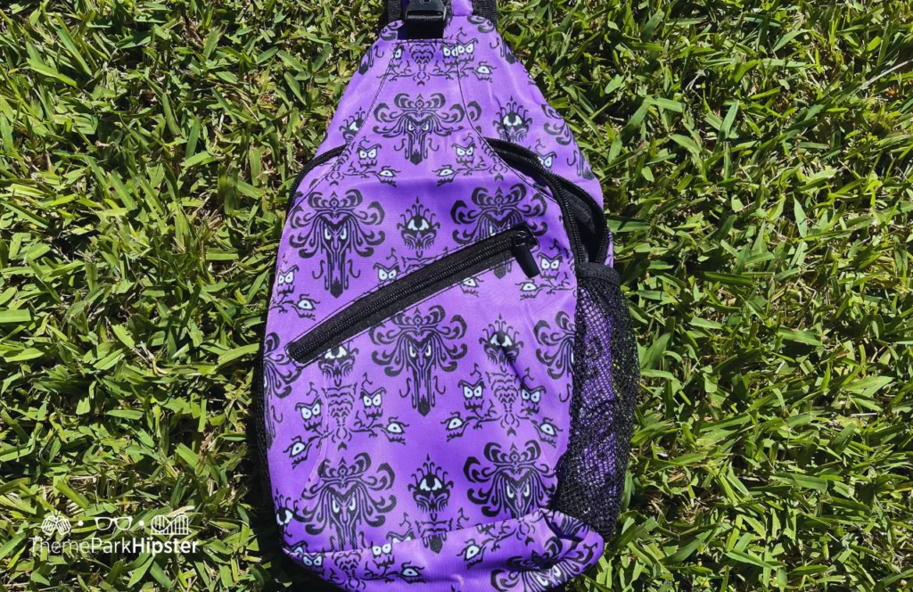 Haunted Mansion Wall Paper Sling Bag. One of the best crossbody bags for Disney World (3)