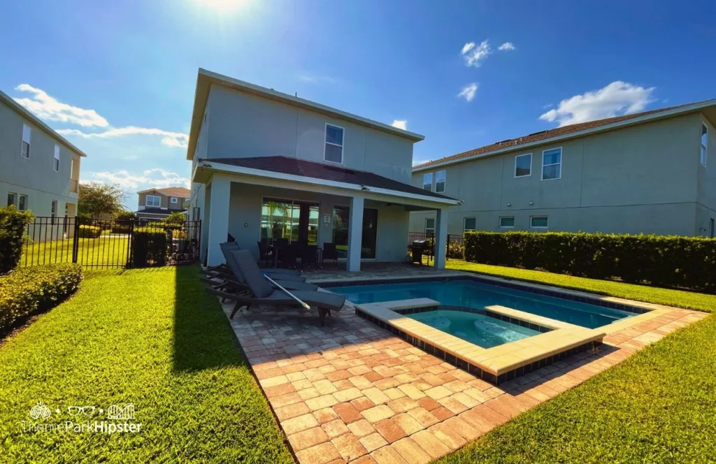 Pool area in 5 Bedroom villa at Encore Resort Review. One of the best vacation home rentals near Disney World. Keep reading to learn how to do Disney World on a budget and save money.