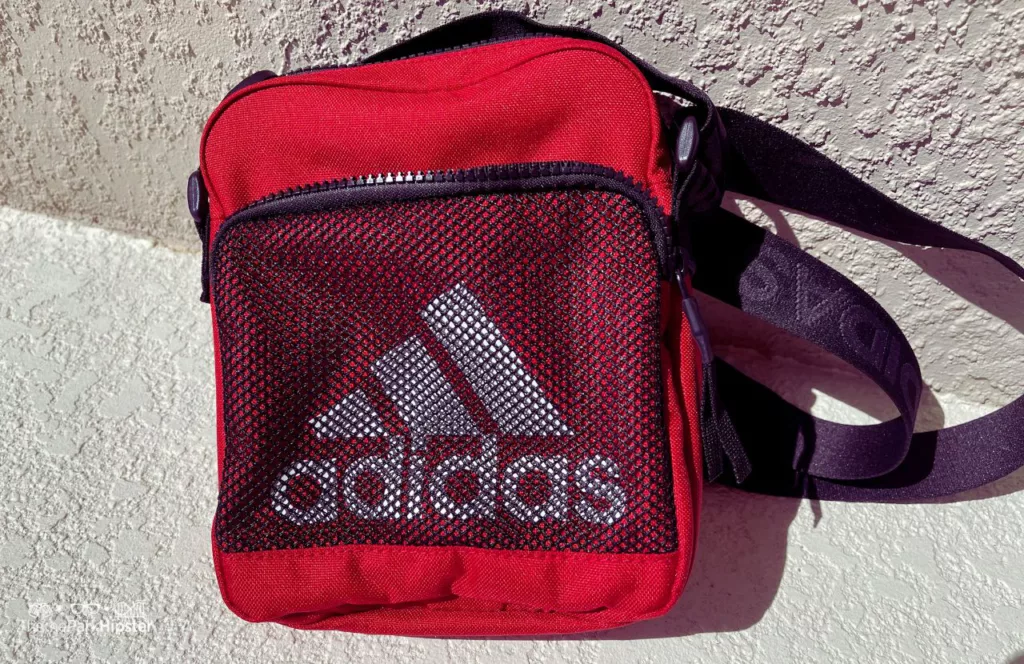 Red Adidas Crossbody Bag. One of the best crossbody bags for Disney World