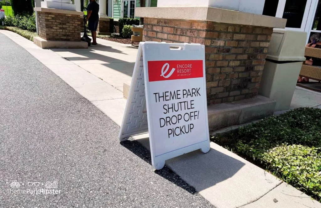 Theme Park shuttle pick up  and drop off area sign at Encore Resort Orlando. Keep reading to hear more about Encore Resort.