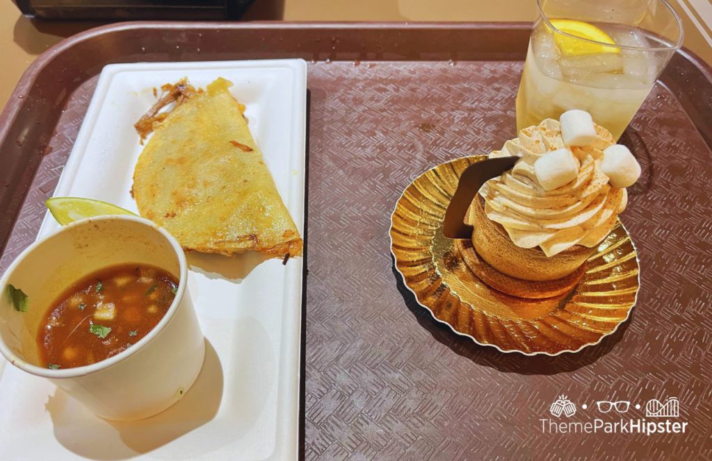 Zero-Proof Piña Colada and Mexican Hot Cocoa Cheesecake and Birria Taco. Hollywood Studios Jollywood Nights Christmas Celebration at Disney World in Holiday Fiesta en La Calle.