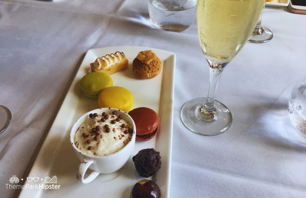 Walt Disney World Epcot Monsieur Paul Restaurant in France Pavilion Dessert platter with macaroons and chocolate mousse with happy birthday with sparkling wine