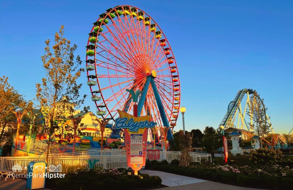 Cedar Point Ohio Amusement Park Calypso Ride with Ferris Wheel and Gatekeeper roller coaster in the background. Keep reading for more Cedar Point Solo Travel Tips!