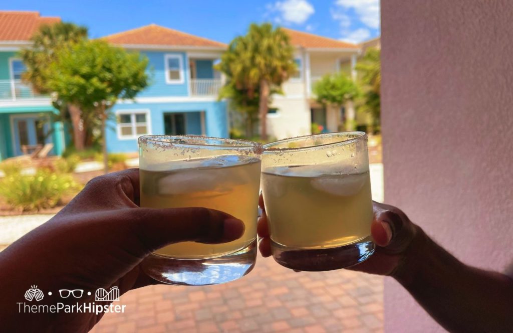 Enjoying a margarita on the balcony at Margaritaville Resort Orlando Hotel. One of the best resorts in Orlando that are not Disney.